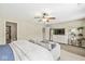 Cozy bedroom featuring a comfortable seating area and a modern entertainment setup at 12259 Sweet Creek Trl, Fishers, IN 46037