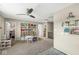 Spacious bonus room featuring built-in shelves, decorative baskets, and a cozy reading nook at 12259 Sweet Creek Trl, Fishers, IN 46037