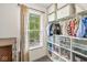 Well-organized closet featuring shelving, hanging rods, and storage bins to maximize space and organization at 12259 Sweet Creek Trl, Fishers, IN 46037