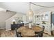 Stylish dining area with a round wooden table, a decorative hutch, and elegant accents at 12259 Sweet Creek Trl, Fishers, IN 46037