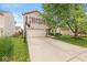 Charming two-story home featuring a spacious driveway, two-car garage, and well-manicured lawn at 12259 Sweet Creek Trl, Fishers, IN 46037