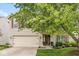 Delightful home featuring a well-manicured lawn, a two-car garage and a charming front entrance at 12259 Sweet Creek Trl, Fishers, IN 46037