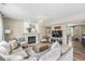 Inviting living room featuring a fireplace, neutral decor, and comfortable seating arrangement at 12259 Sweet Creek Trl, Fishers, IN 46037