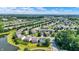 Expansive aerial view of a neighborhood with lush greenery, ponds, and well-maintained homes at 12322 Cool Winds W Way, Fishers, IN 46037