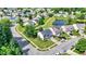 Aerial view of a home situated near a pond, surrounded by well-maintained lawns and tree-lined streets at 12322 Cool Winds W Way, Fishers, IN 46037