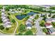 This aerial view showcases a neighborhood with lush landscaping, a serene pond, and easy access to main roads at 12322 Cool Winds W Way, Fishers, IN 46037