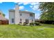 Large backyard with lush lawn, a patio, a grill and mature landscaping at 12322 Cool Winds W Way, Fishers, IN 46037
