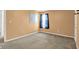 This bedroom features neutral carpet, orange walls, and a window with blue curtains and a white dry erase board at 12322 Cool Winds W Way, Fishers, IN 46037