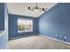Bedroom with blue walls, ceiling fan and carpeted floor at 12322 Cool Winds W Way, Fishers, IN 46037