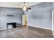 This bedroom features wood floors, light blue walls, a black desk and an ensuite bathroom at 12322 Cool Winds W Way, Fishers, IN 46037