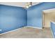 Bedroom with blue walls, ceiling fan and carpeted floor at 12322 Cool Winds W Way, Fishers, IN 46037