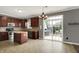 Kitchen with stainless appliances, island and a view of the patio through sliding glass doors at 12322 Cool Winds W Way, Fishers, IN 46037