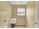 Functional laundry room with white sink, and wire rack shelving at 12322 Cool Winds W Way, Fishers, IN 46037