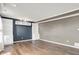 Spacious living room with hardwood floors, built-in shelving, and neutral paint at 12322 Cool Winds W Way, Fishers, IN 46037