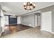 Living room with hard wood floors, fireplace and a view into the dining area at 12322 Cool Winds W Way, Fishers, IN 46037