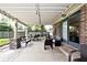 Covered patio featuring brick supports and a peaceful backyard seating area at 1345 Westwind Dr, Avon, IN 46123