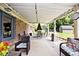 Relaxing covered patio with outdoor seating area to enjoy views of the backyard at 1345 Westwind Dr, Avon, IN 46123