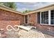 Brick ranch-style home with decorative stone walkway leading to the front door at 1345 Westwind Dr, Avon, IN 46123