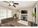 Inviting living area with stone fireplace, wood-look floors, and ample natural light at 1345 Westwind Dr, Avon, IN 46123