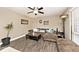 Cozy living area with a ceiling fan, stylish decor, and wood-look flooring at 1345 Westwind Dr, Avon, IN 46123