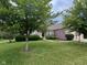 Charming brick home with mature trees and lush landscaping at 13744 Fieldshire Ter, Carmel, IN 46074