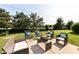Backyard patio featuring outdoor seating and well-manicured landscaping at 14109 Secretariat Ct, Carmel, IN 46074