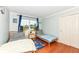 Charming bedroom with two twin beds, hardwood floors, and a bright window at 14109 Secretariat Ct, Carmel, IN 46074