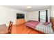 Cozy bedroom with wood floors and a large window for natural light at 14109 Secretariat Ct, Carmel, IN 46074