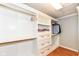 Walk-in closet with custom shelving and ample storage space at 14109 Secretariat Ct, Carmel, IN 46074