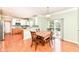 Dining area adjacent to a bright kitchen with stainless steel appliances and backyard access at 14109 Secretariat Ct, Carmel, IN 46074