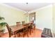 Traditional dining room featuring a wooden table, matching chairs, and a chandelier, creating a warm atmosphere at 14109 Secretariat Ct, Carmel, IN 46074