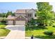 Charming two-story home with a well-manicured lawn, attached three-car garage, and inviting curb appeal at 14109 Secretariat Ct, Carmel, IN 46074