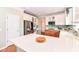 Well-appointed kitchen boasts white cabinets, an island with countertop seating, and stainless steel appliances at 14109 Secretariat Ct, Carmel, IN 46074