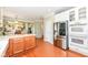 Open kitchen layout featuring stainless steel appliances, a kitchen island and hardwood floors at 14109 Secretariat Ct, Carmel, IN 46074