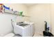 Laundry room featuring modern washer and dryer and wire rack for storage at 14109 Secretariat Ct, Carmel, IN 46074