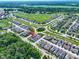 Aerial view of home in a suburban neighborhood with green spaces and manicured lawns at 14234 Community Dr, Carmel, IN 46033