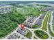 Aerial view of the house and its neighborhood showcases the surrounding trees at 14234 Community Dr, Carmel, IN 46033