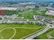 High aerial view shows community layout, amenities, and green spaces at 14234 Community Dr, Carmel, IN 46033