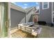 Cozy backyard patio with comfortable seating, a grill, and stone landscaping at 14234 Community Dr, Carmel, IN 46033