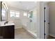 Bright bathroom with glass shower, and double sinks at 14234 Community Dr, Carmel, IN 46033