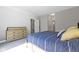 Neutral bedroom with large bed, neutral dresser, and carpeted floors at 14234 Community Dr, Carmel, IN 46033