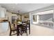 Open floor plan featuring kitchen and dining areas with a view to the private yard; ideal for gatherings at 14234 Community Dr, Carmel, IN 46033