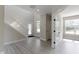Bright entryway featuring a staircase, light gray floors and neutral paint colors, all illuminated by natural light at 14234 Community Dr, Carmel, IN 46033