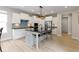 Modern kitchen featuring white cabinets, a center island with seating, and stainless steel appliances at 14234 Community Dr, Carmel, IN 46033