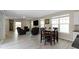 Open-concept living room featuring a dining area, comfortable seating, and plenty of natural light at 14234 Community Dr, Carmel, IN 46033