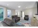 Spacious living room featuring a view to the yard, neutral paint, recessed lights, and comfortable seating at 14234 Community Dr, Carmel, IN 46033