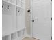 Well-organized mudroom with built-in storage, hooks, and a convenient bench, designed for efficient and stylish organization at 14234 Community Dr, Carmel, IN 46033