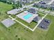 Aerial view of a community pool, playground, and basketball court, perfect for Gathering fun at 14234 Community Dr, Carmel, IN 46033