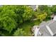 Bird's eye view of home with large green backyard, wood fence, and deck with outdoor seating at 14492 Cotswold Ln, Carmel, IN 46033