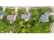 Aerial view of home with neighboring houses, green lawns, and surrounding trees at 14492 Cotswold Ln, Carmel, IN 46033